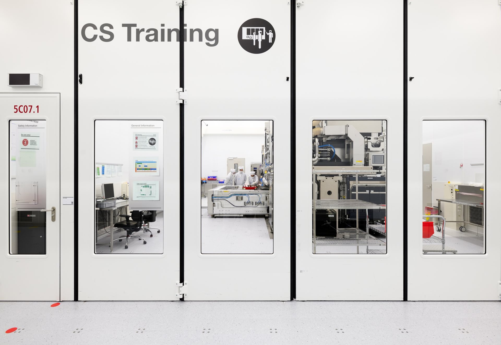Engineers working together in a cleanroom