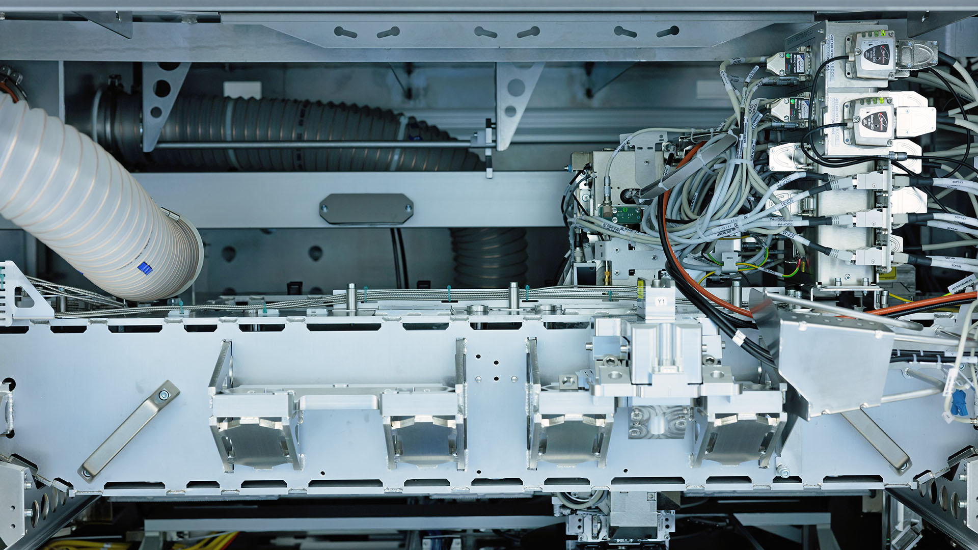 Interior view of ASML's YieldStar system showcasing the intricate machinery and circuitry. Interior view of ASML's YieldStar system showcasing the intricate machinery and circuitry.