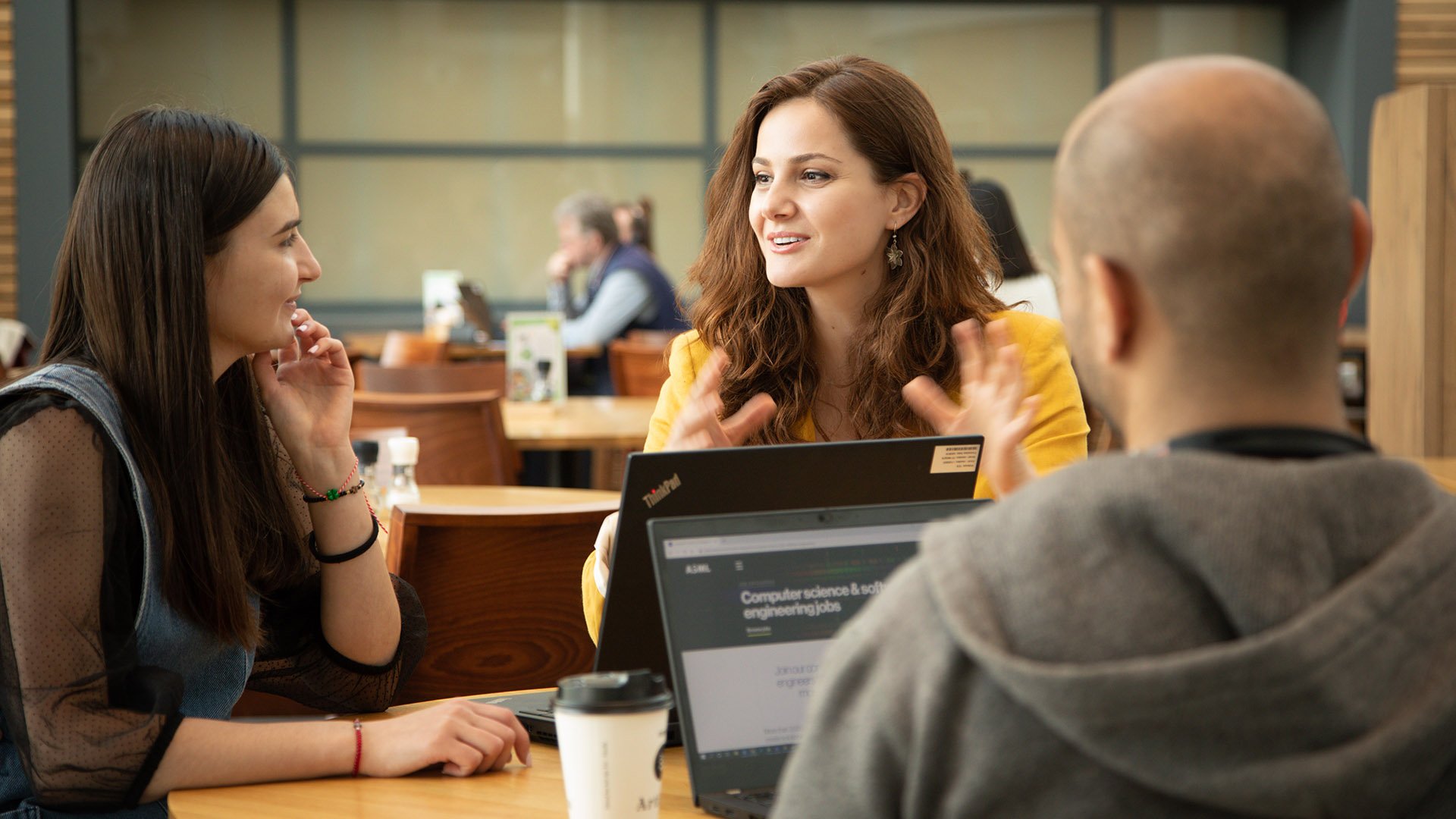 Software architect Melis Ozgur talks with colleagues at ASML in Veldhoven, the Netherlands. Software architect Melis Ozgur talks with colleagues at ASML in Veldhoven, the Netherlands.
