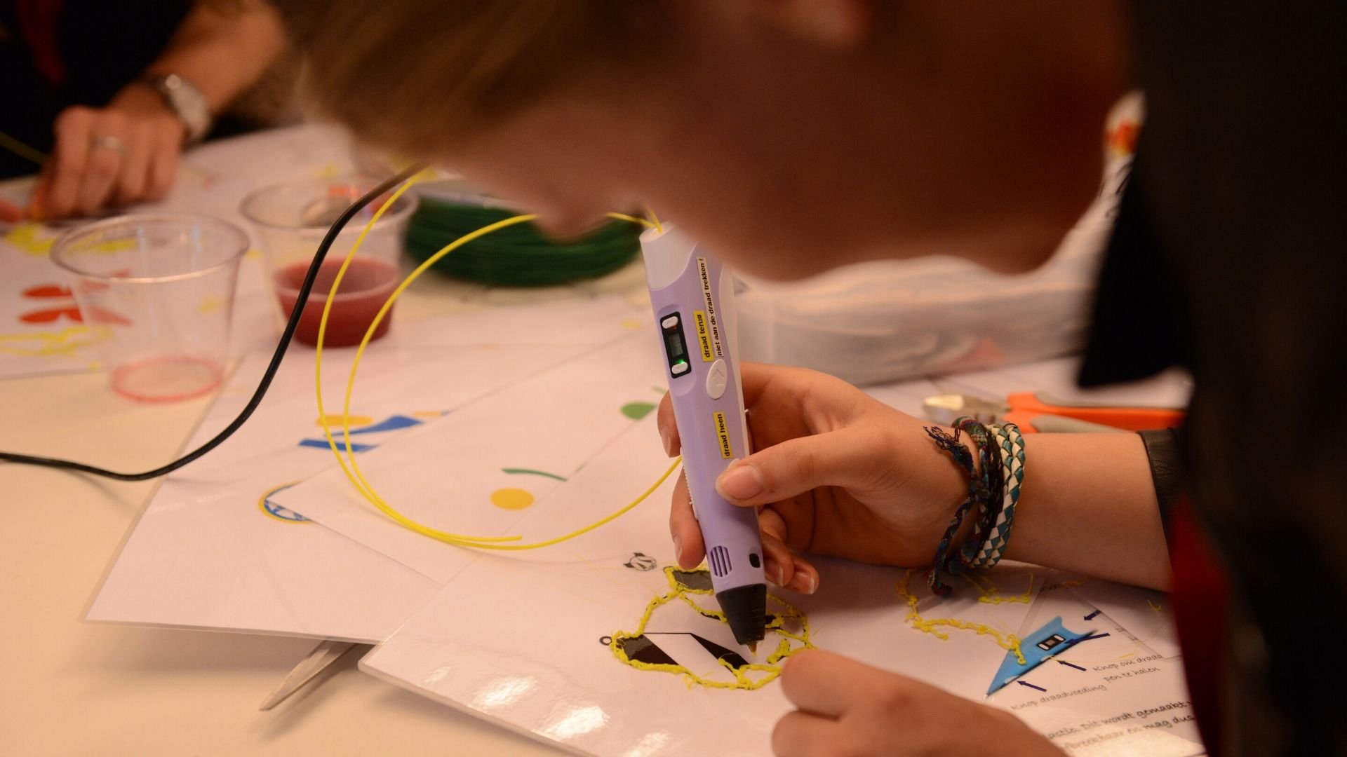 A teenager uses technology for crafts at ASML's annual Girls Day in Veldhoven, the Netherlands A teenager uses technology for crafts at ASML's annual Girls Day in Veldhoven, the Netherlands