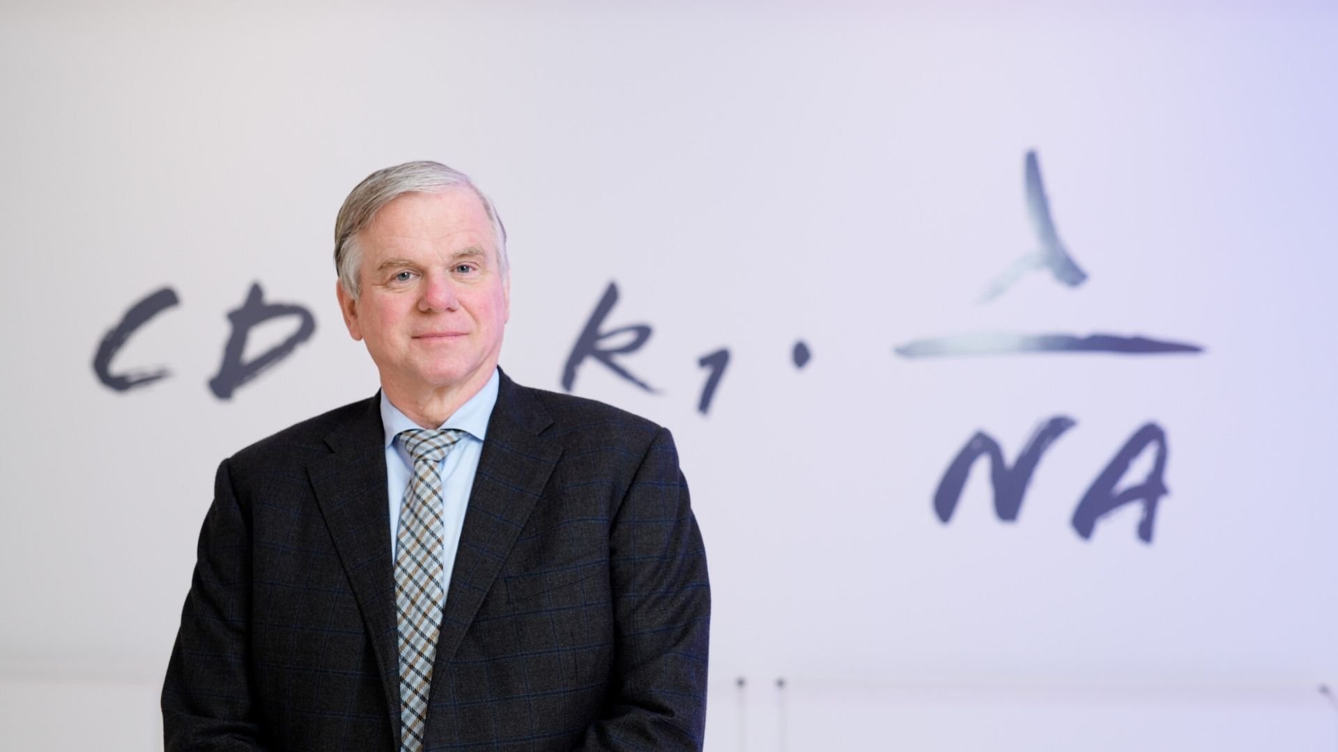 ASML CTO Martin van den Brink stands in front of the Rayleigh criterion equation in the ASML Experience Center in Veldhoven, the Netherlands. ASML CTO Martin van den Brink stands in front of the Rayleigh criterion equation in the ASML Experience Center in Veldhoven, the Netherlands.