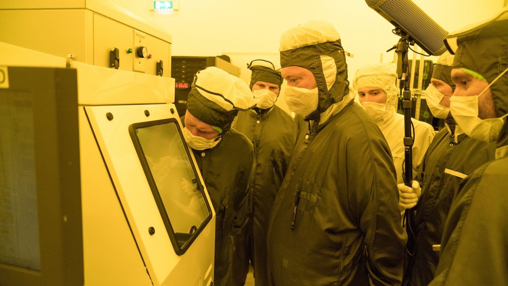 Cleanroom technicians inspect the wafer containing the Guiness World Record-holding smallest advertisement at ASML in Veldhoven, the Netherlands. Cleanroom technicians inspect the wafer containing the Guiness World Record-holding smallest advertisement at ASML in Veldhoven, the Netherlands.